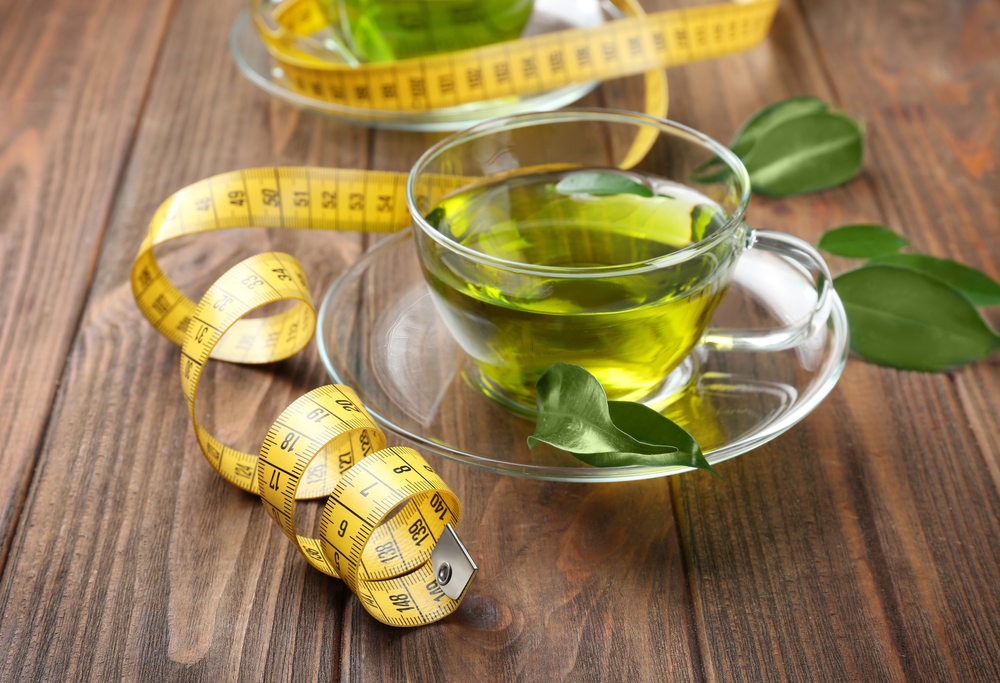 Green tea leaves and a cup of green tea